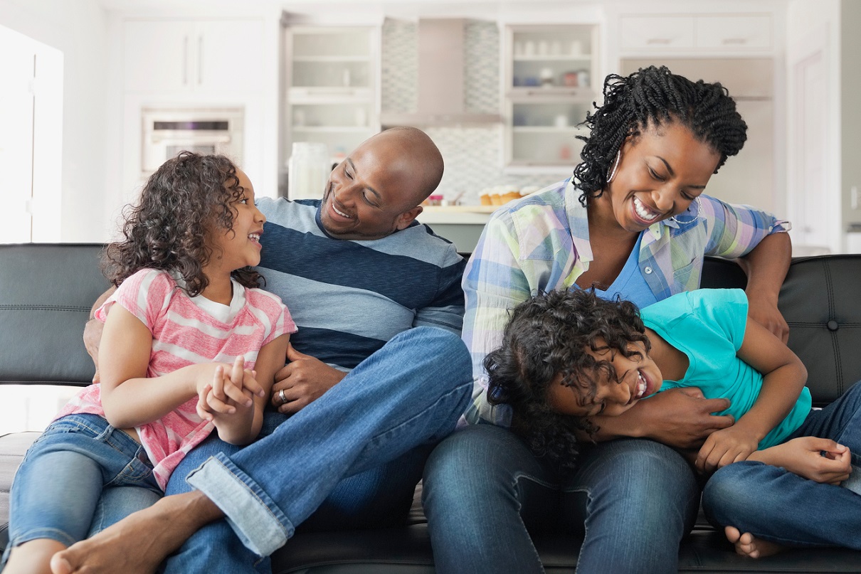 Family laughing together at home