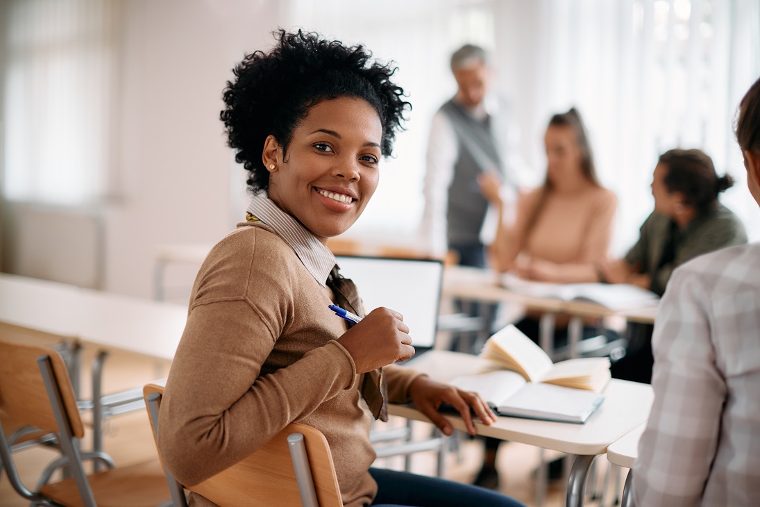 Smiling adult at desk Smiling adult at desk