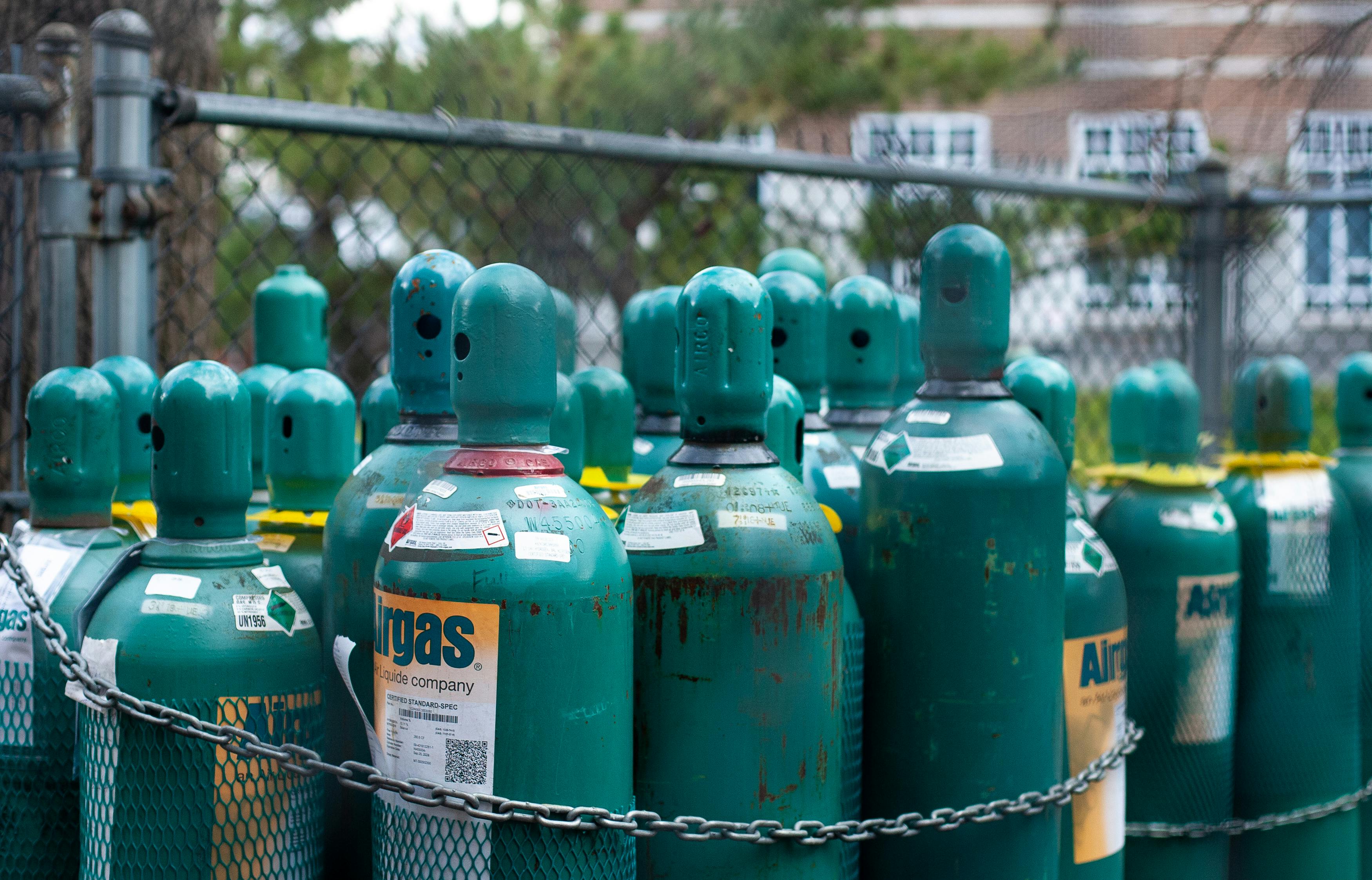 A group of small green gas tanks