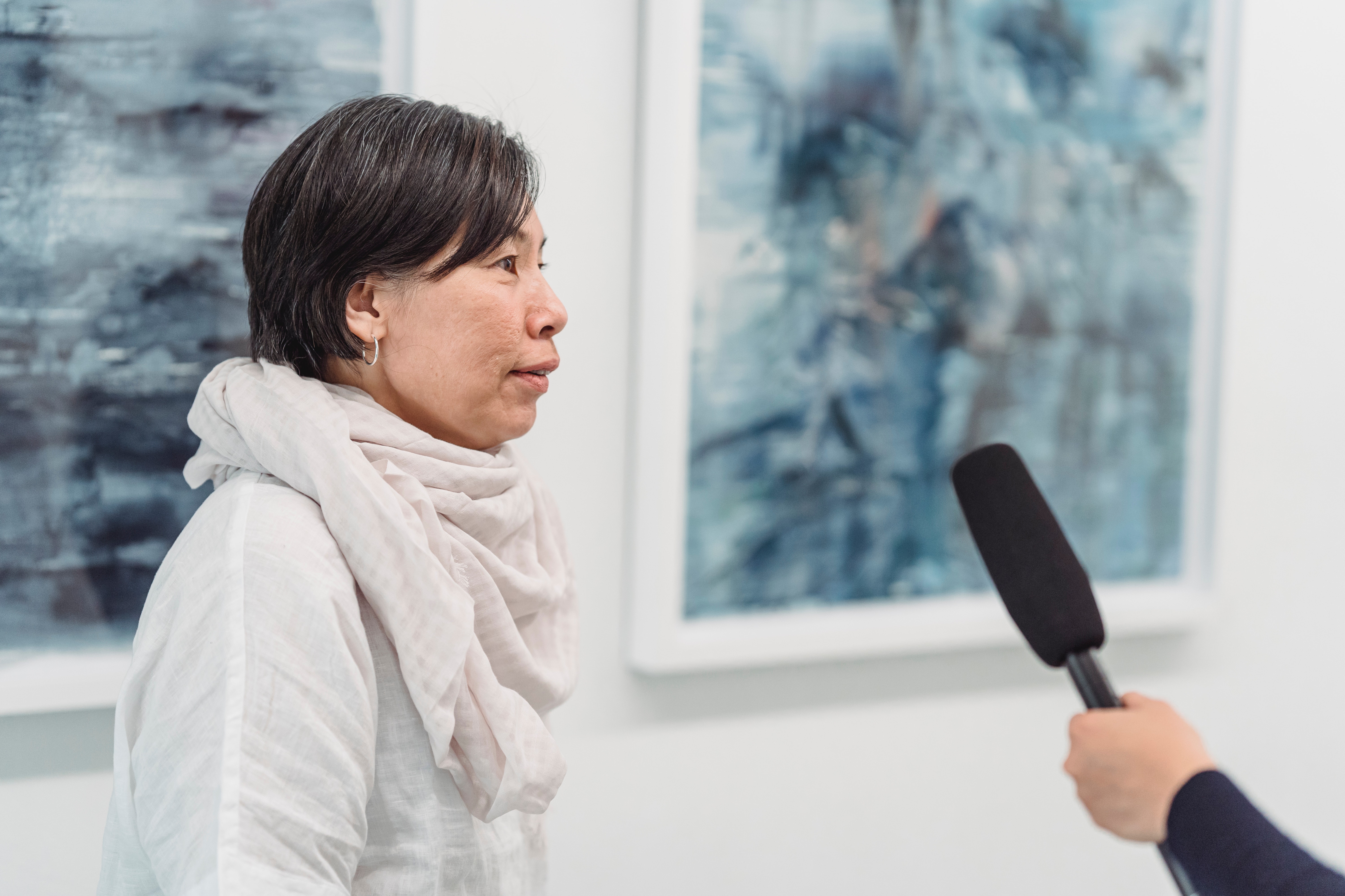 Person speaking into microphone