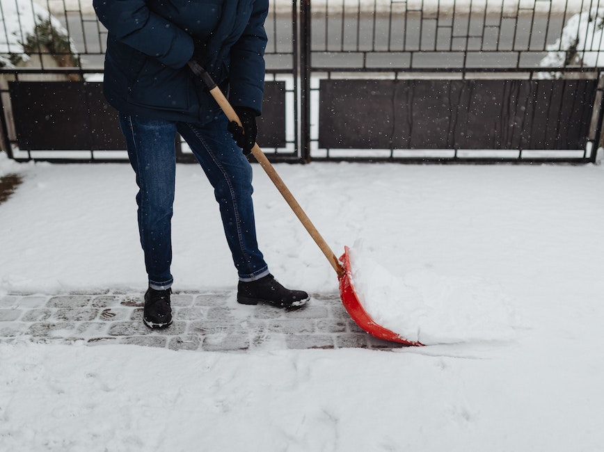 person shoveling path in snow person shoveling path in snow
