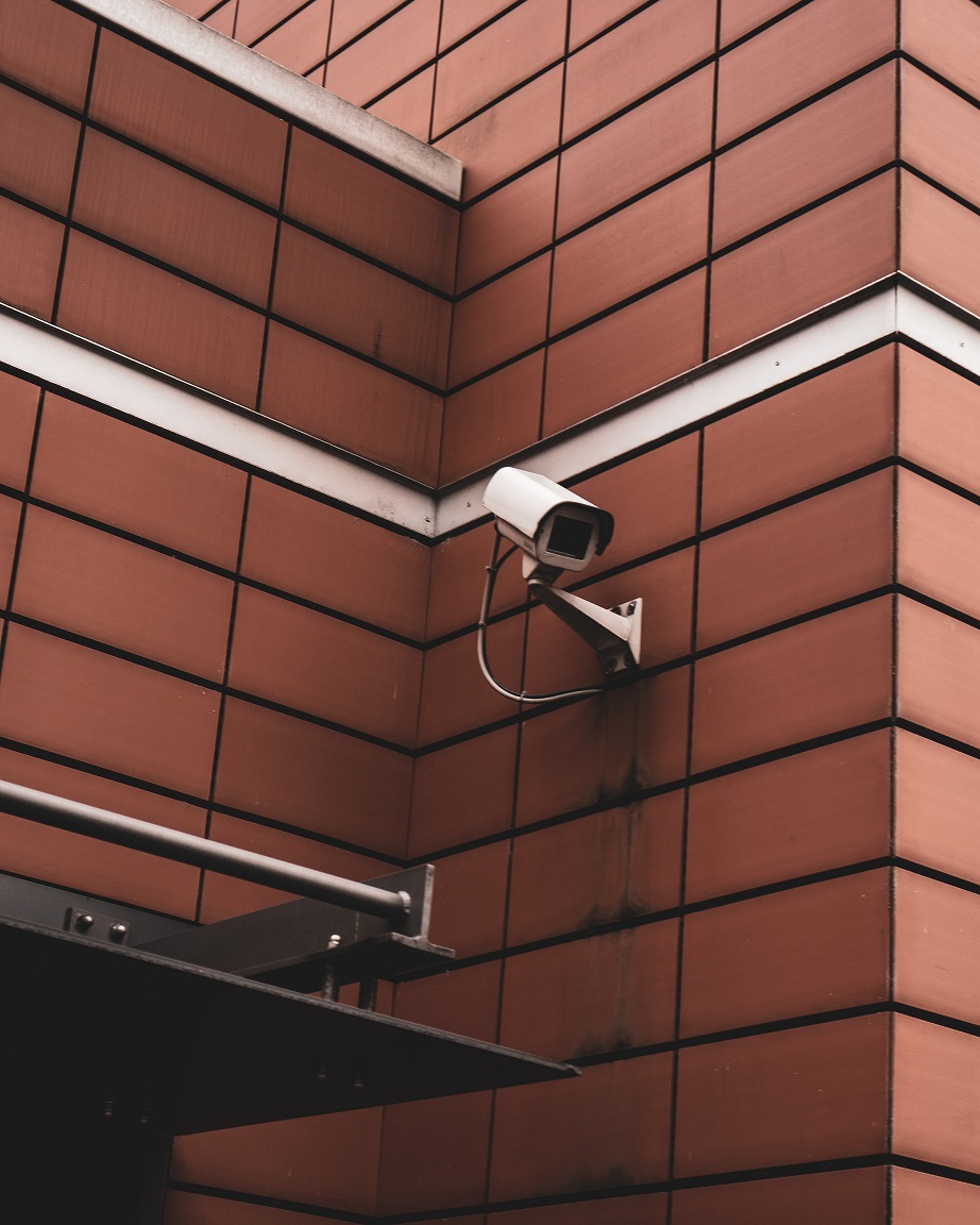 Security camera on an exterior brick wall