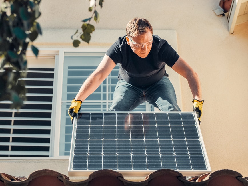 Person installing solar panels