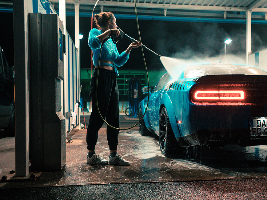 person washing a car