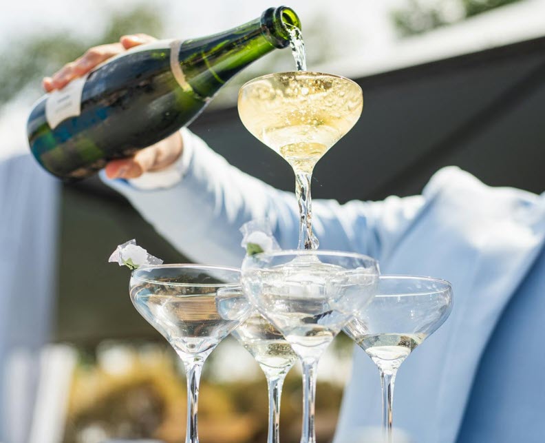 Wine glasses and flowers at event