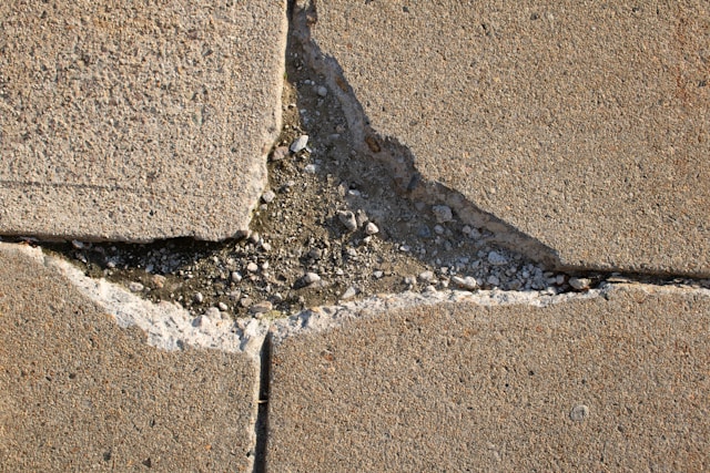 Damaged sidewalk Damaged sidewalk