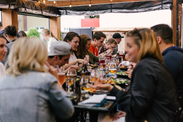 people eating under a tent