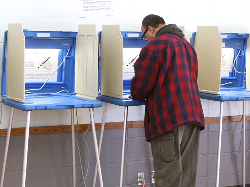 Voter at a pollbooth